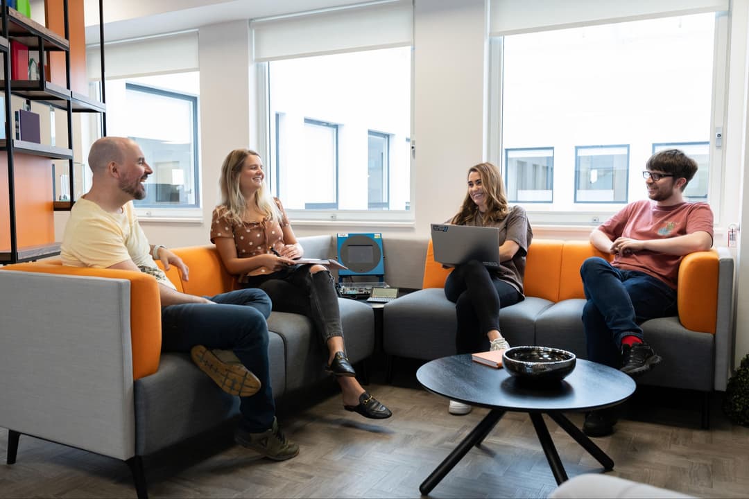 The Apadmi team sat on the sofas