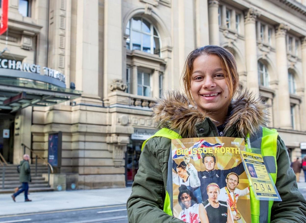 big-issue-north-vendor-holding-magazine