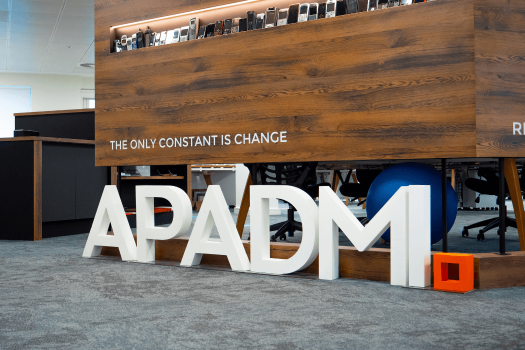 Apadmi letters in office image