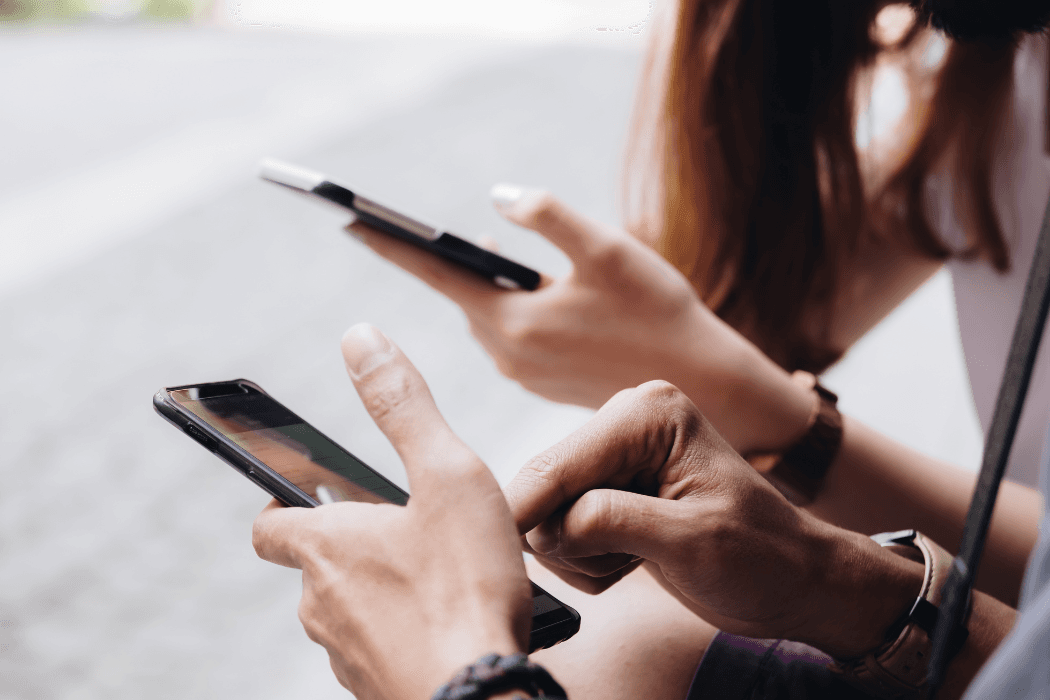 Stock image phones in hands