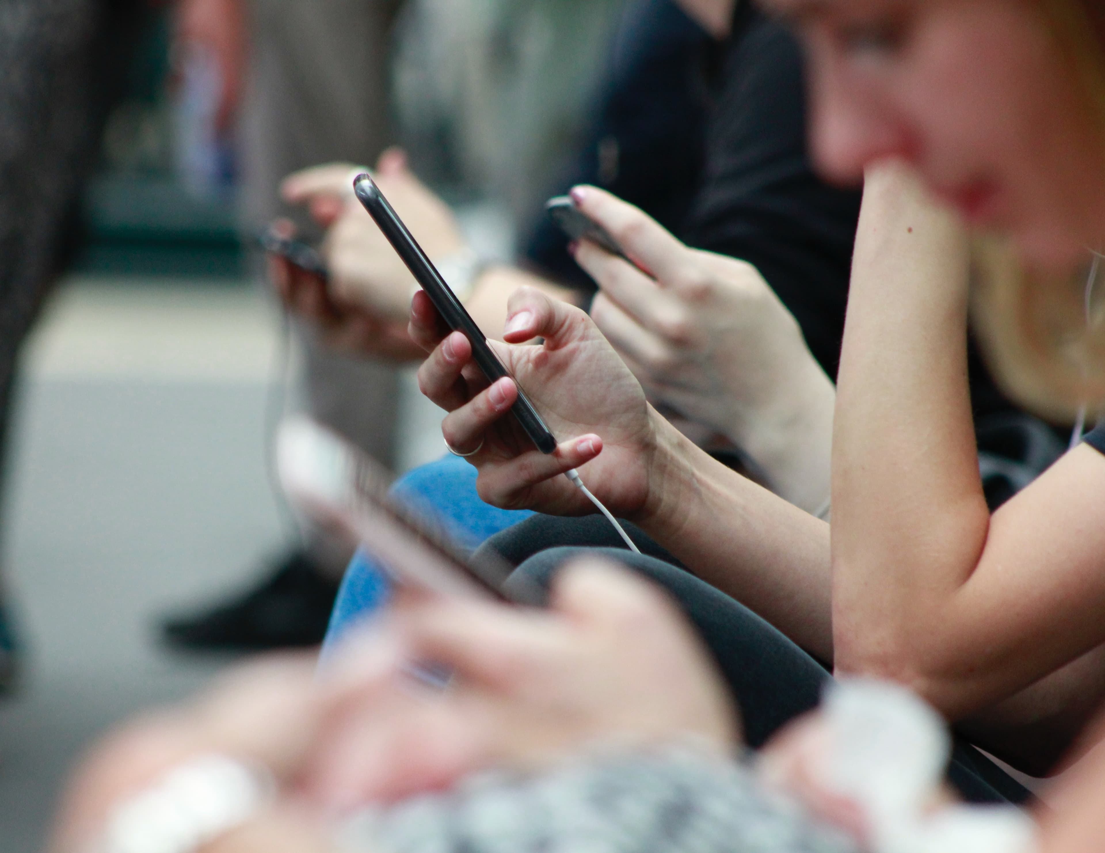 Multiple mobile phone users - apps drive engagement - Apadmi