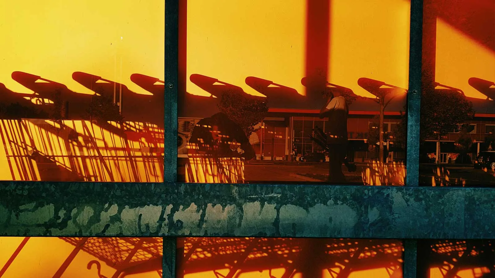 Blurred shopping trolleys in orange light