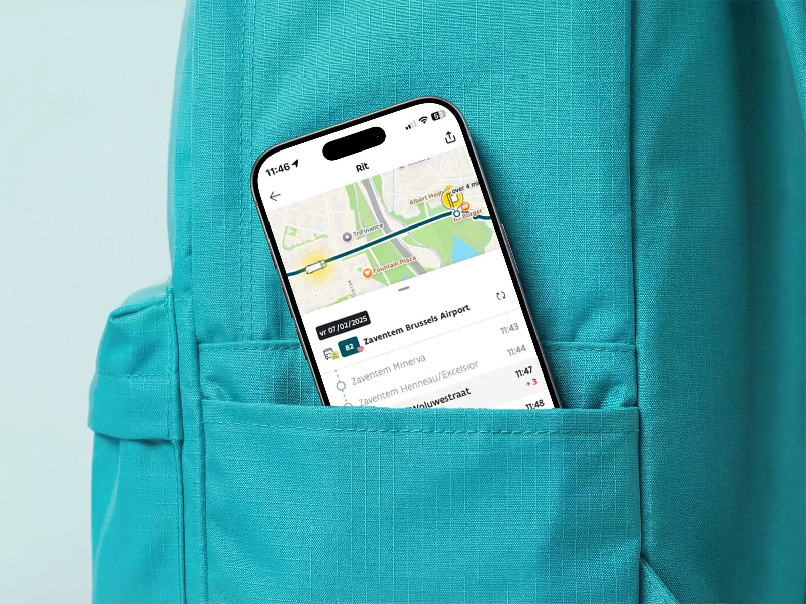 An iPhone displaying the Di Lijn app peeks out of a green rucksack.