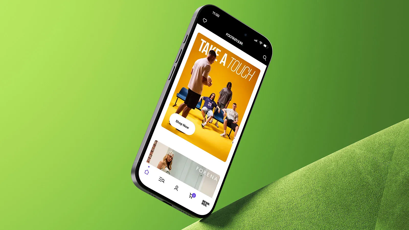A phone displaying the Footasylum app on a green background.