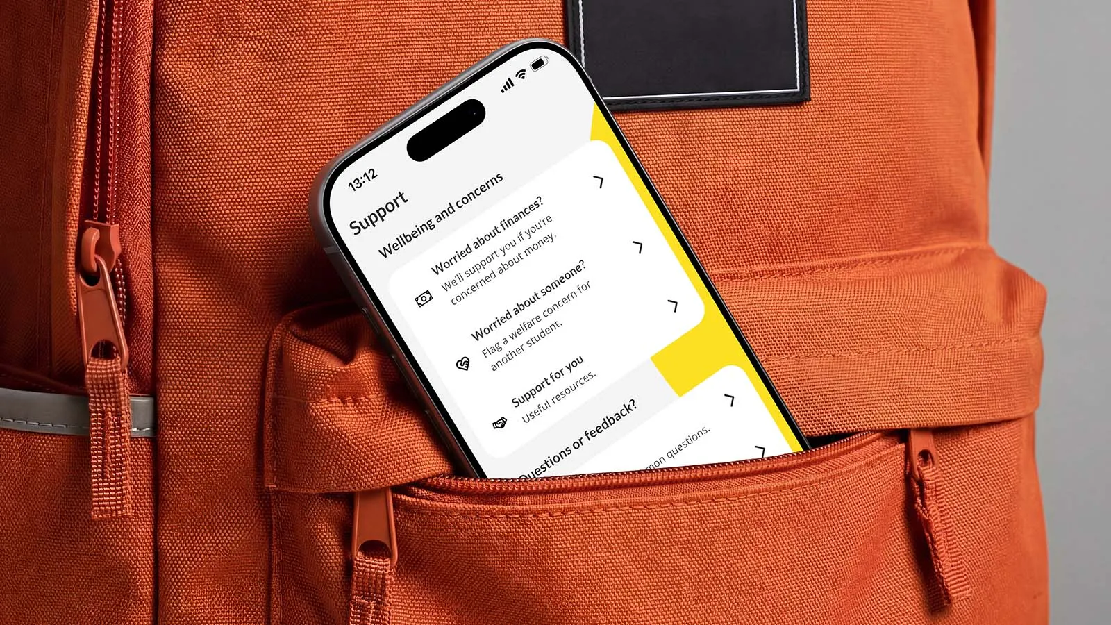 A phone displaying the Unite Students app peeks out of a rucksack.