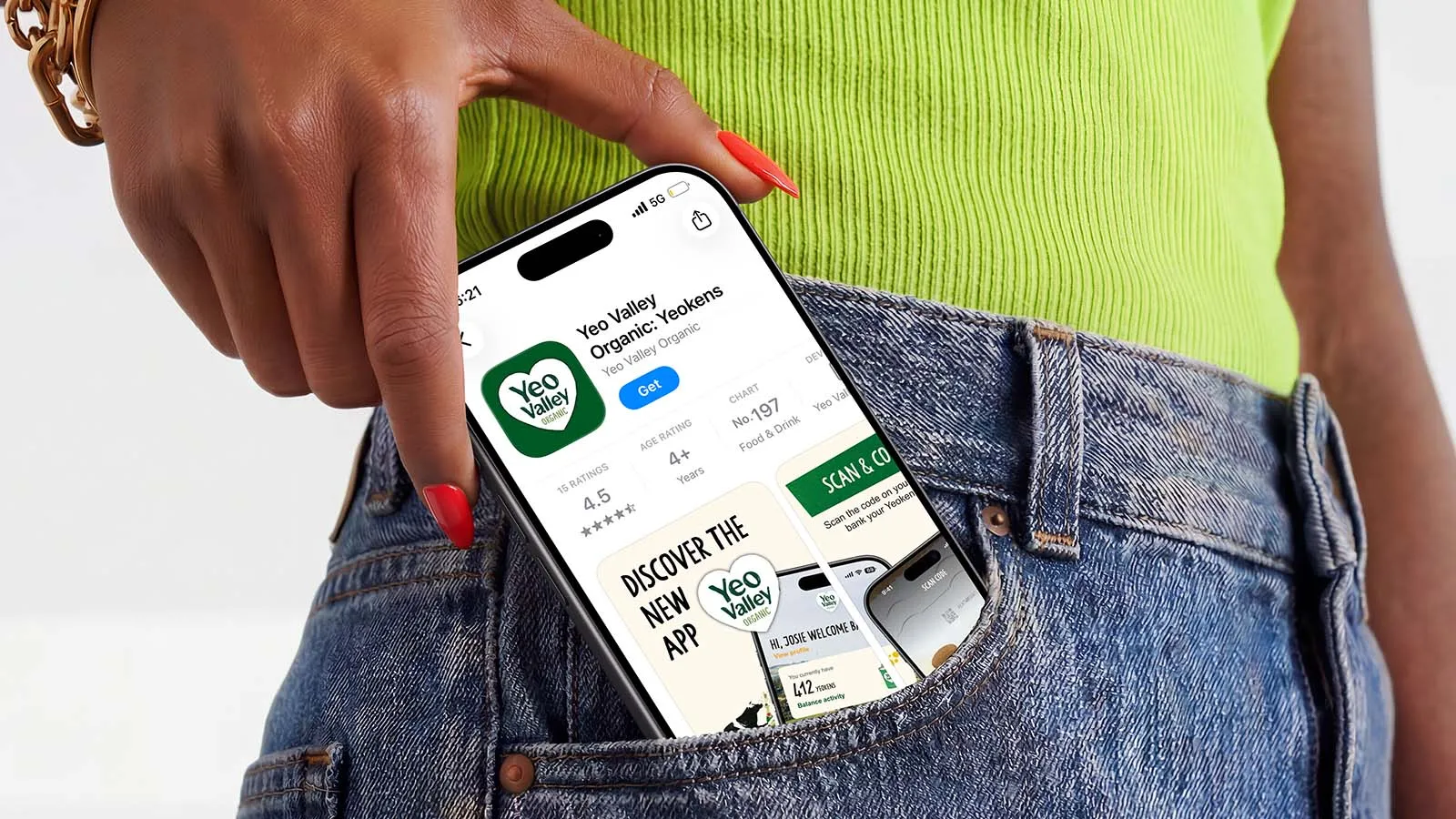 An iPhone showing the Yeo Valley app being taken out of a woman's jeans pocket.